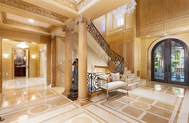 a view of a hallway with a chandelier