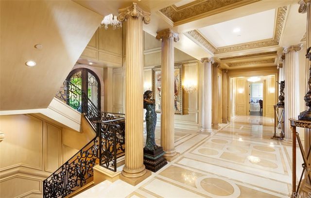 a living room with furniture fireplace and a large window