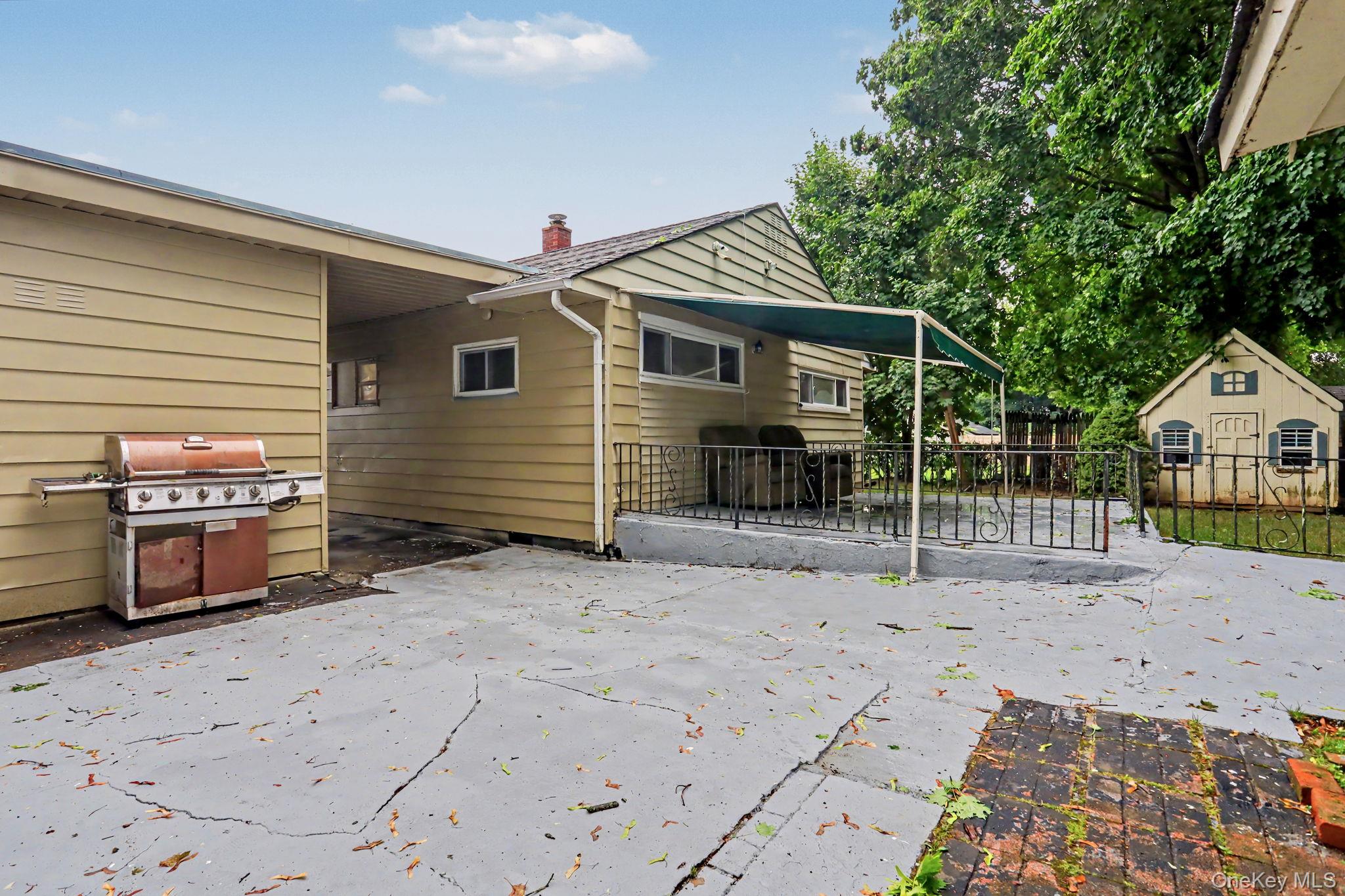 376 County Center Road White Plains, NY 10603 - Photo 26 of 40 Large patio with awning and BBQ area.