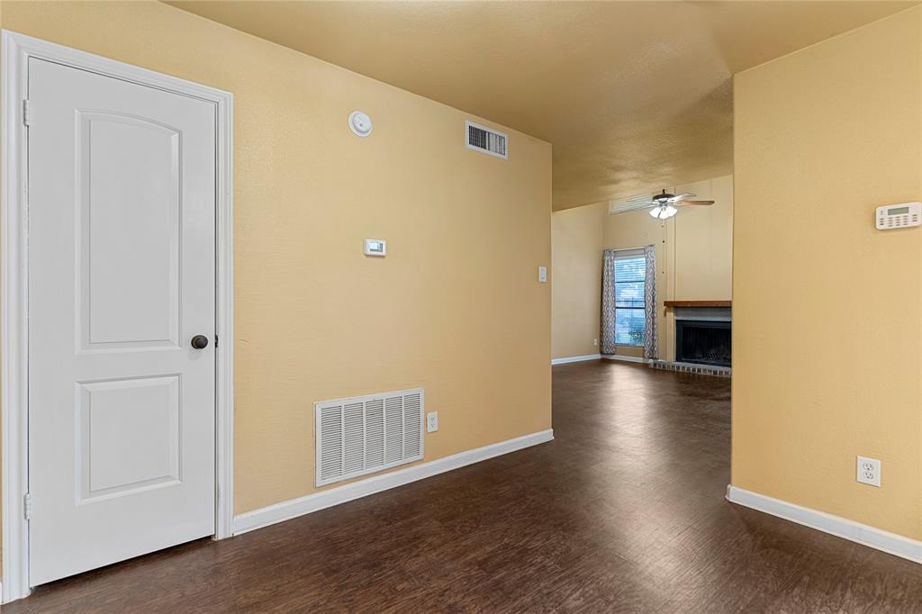 5516 Boca Raton Boulevard, Unit 310 Fort Worth, TX 76112 - Photo 4 of 19 a view of a hallway with wooden floor