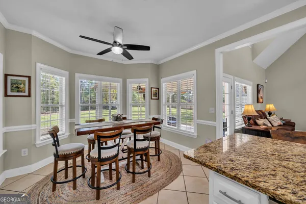 a view of a dining room with furniture window and outside view