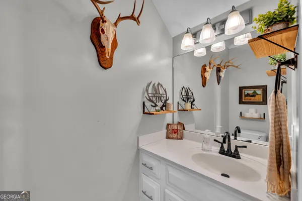 a bathroom with a sink and mirror