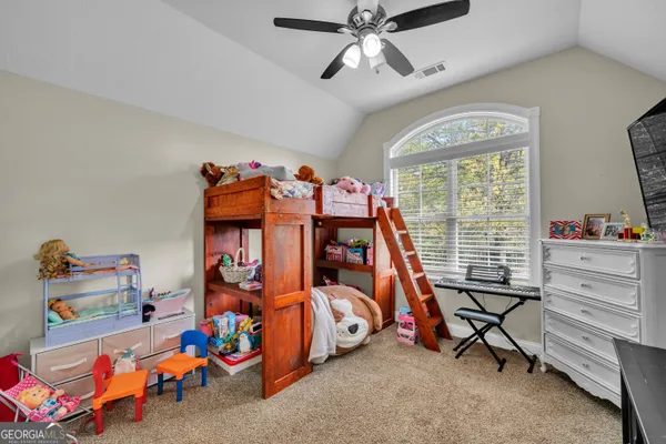 a bedroom with bunk beds and a window