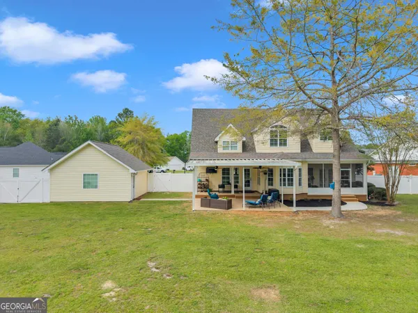 a view of a house with a big yard