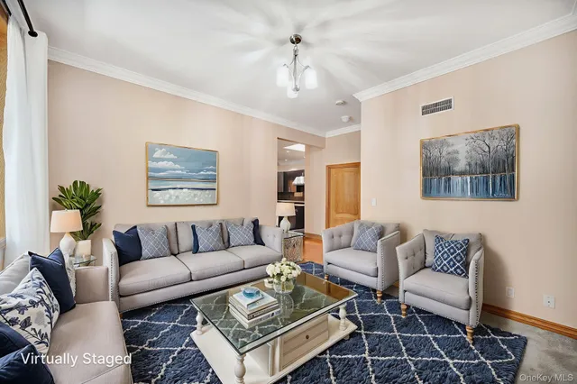 a living room with furniture and a rug