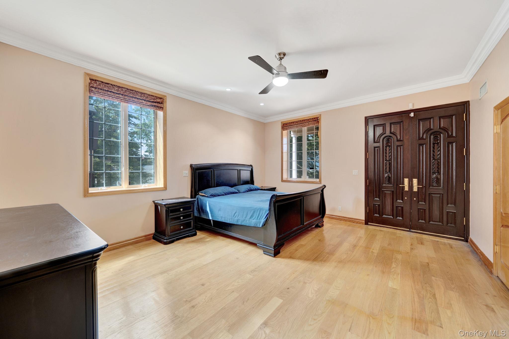 84-29 Kendrick Place Queens, NY 11432 - Photo 17 of 50 a spacious bedroom with a bed and a window