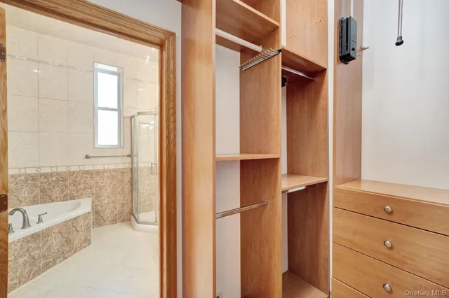 a bathroom with a bathtub and shower