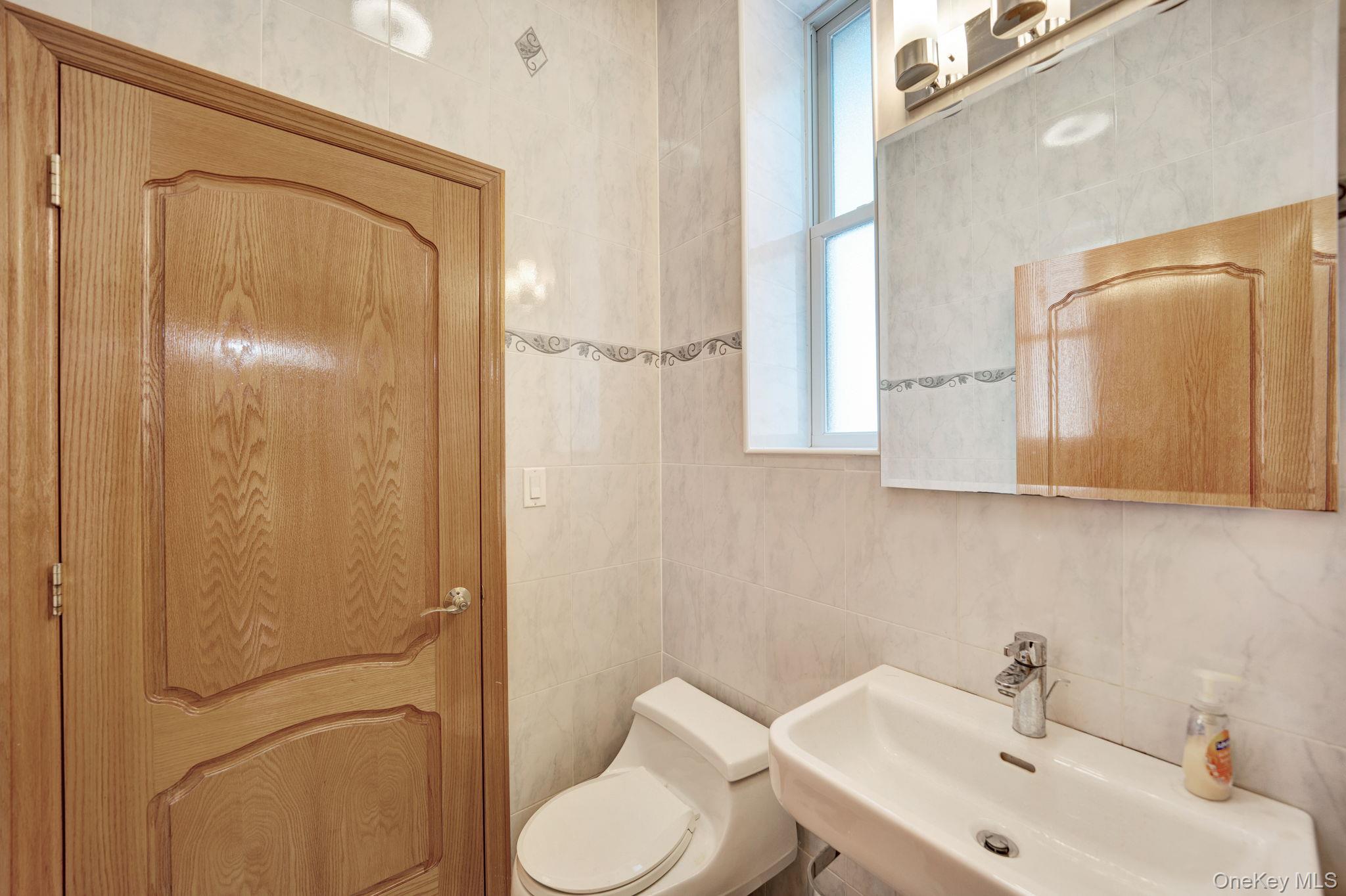 84-29 Kendrick Place Queens, NY 11432 - Photo 21 of 50 a bathroom with a sink a toilet and shower