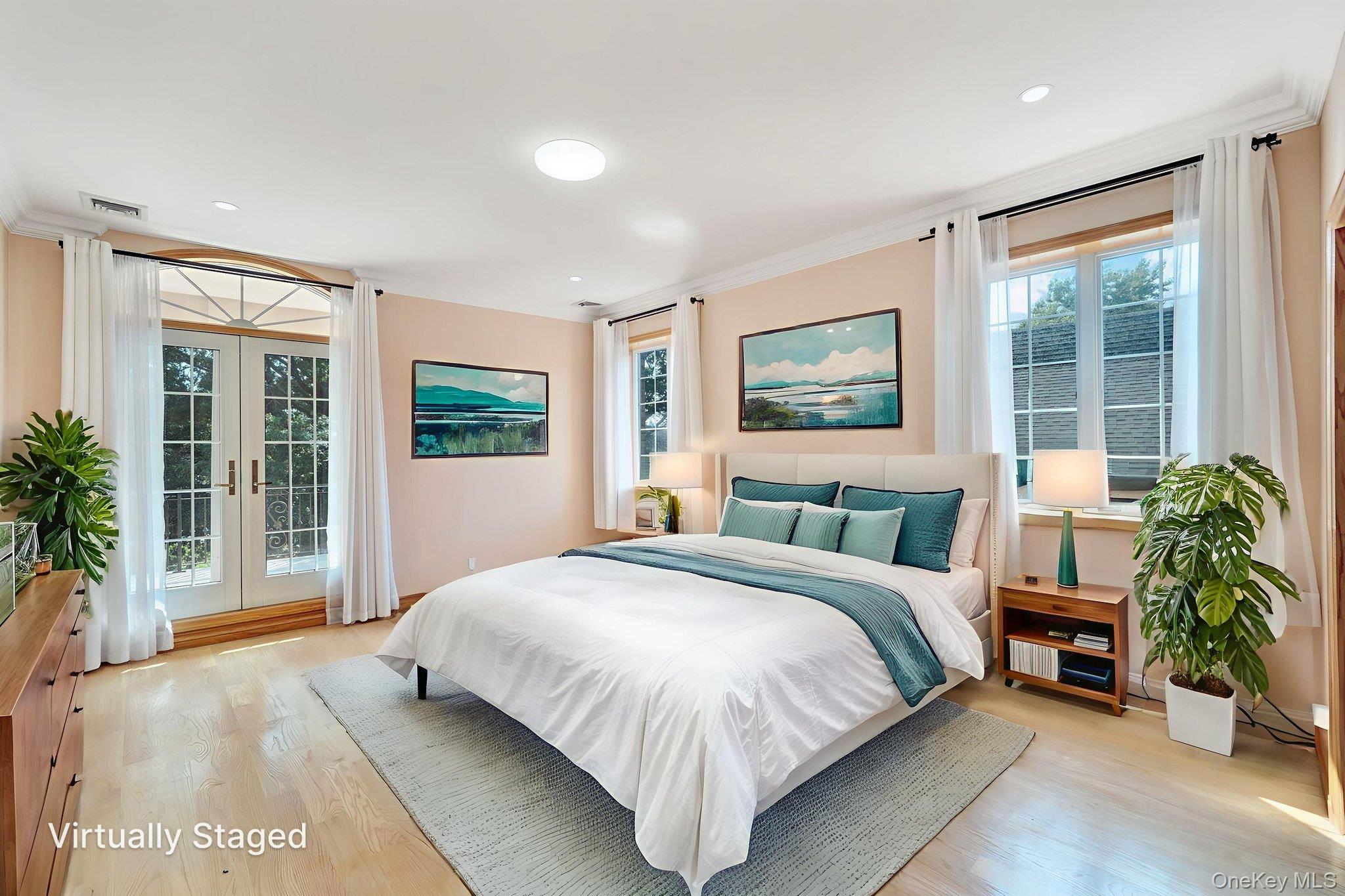 84-29 Kendrick Place Queens, NY 11432 - Photo 24 of 50 a spacious bedroom with a large bed and a large window