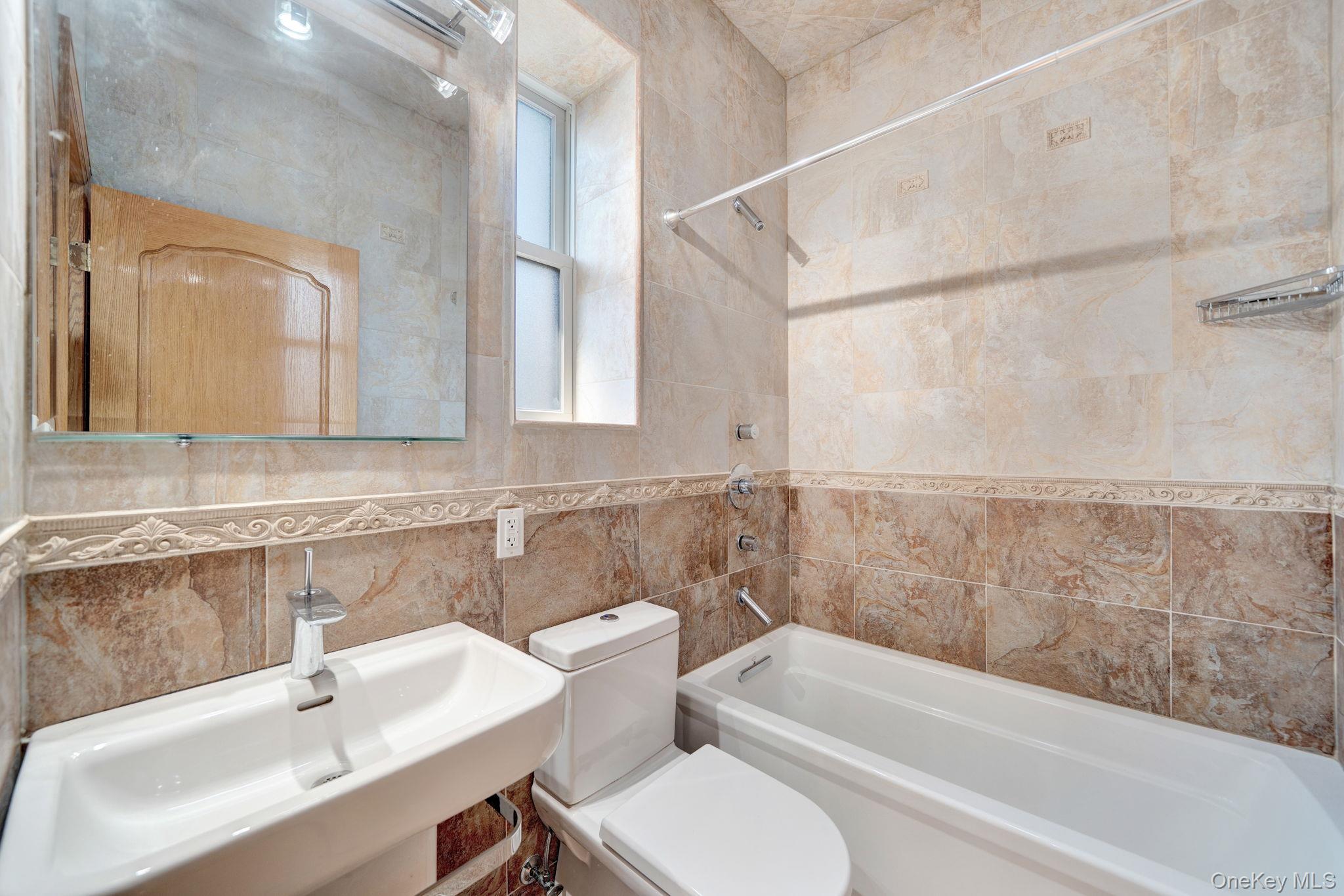 84-29 Kendrick Place Queens, NY 11432 - Photo 25 of 50 a bathroom with a sink and a bathtub