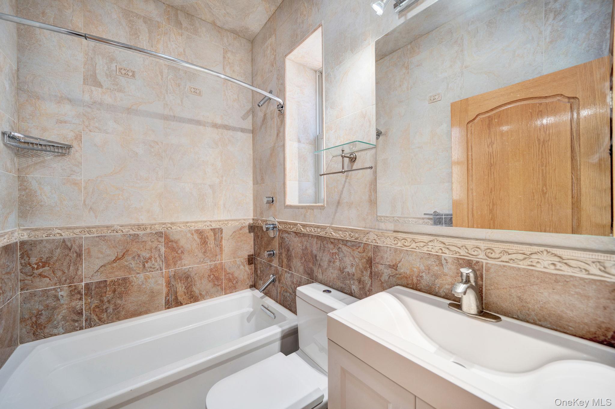 84-29 Kendrick Place Queens, NY 11432 - Photo 27 of 50 a bathroom with a sink toilet and shower