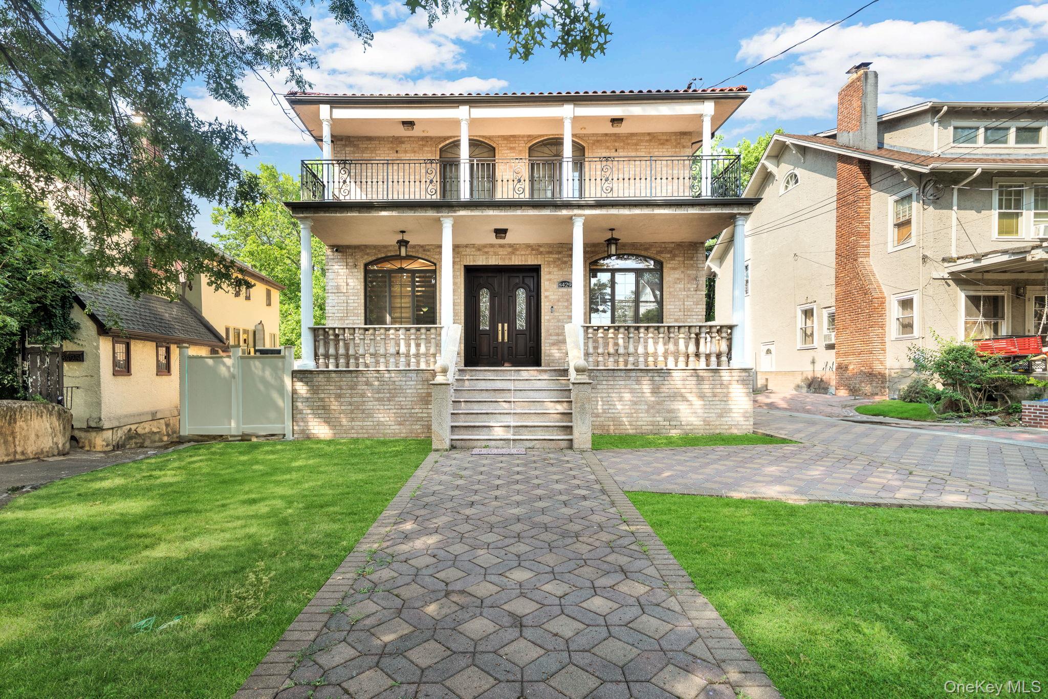 84-29 Kendrick Place Queens, NY 11432 - Photo 3 of 50 a front view of a house with a yard and garden