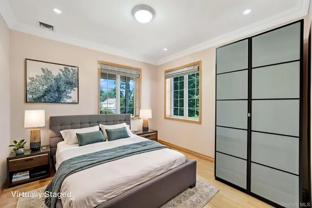 a bedroom with a large bed and a window