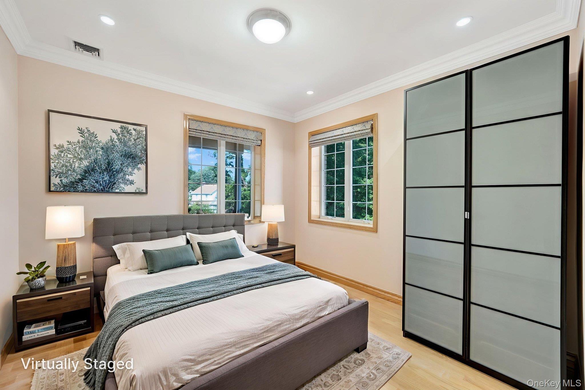 84-29 Kendrick Place Queens, NY 11432 - Photo 31 of 50 a bedroom with a large bed and a window