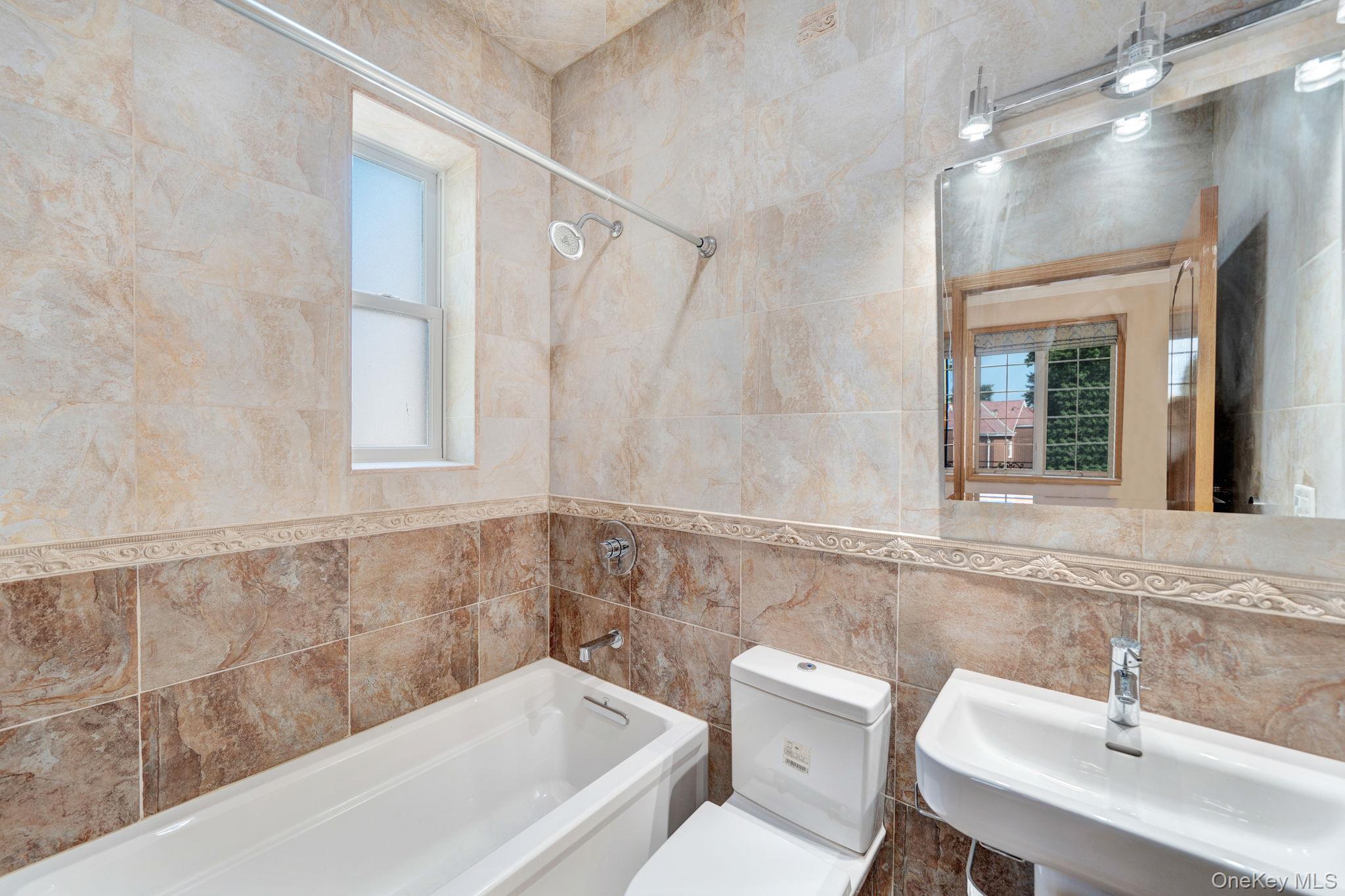 84-29 Kendrick Place Queens, NY 11432 - Photo 32 of 50 a bathroom with a sink and a bathtub