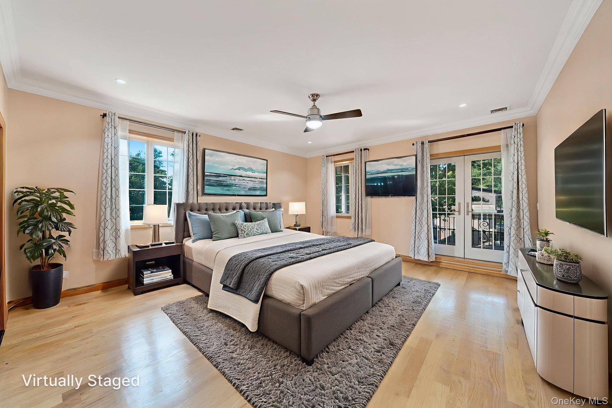 84-29 Kendrick Place Queens, NY 11432 - Photo 34 of 50 a spacious bedroom with a large bed a flat tv screen and a dresser