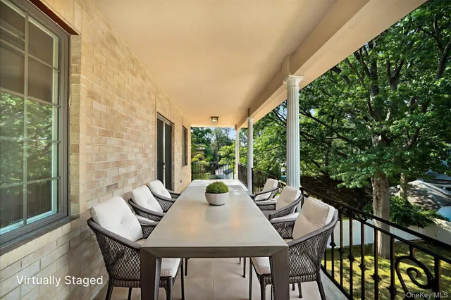 a view of a patio with a table and chairs