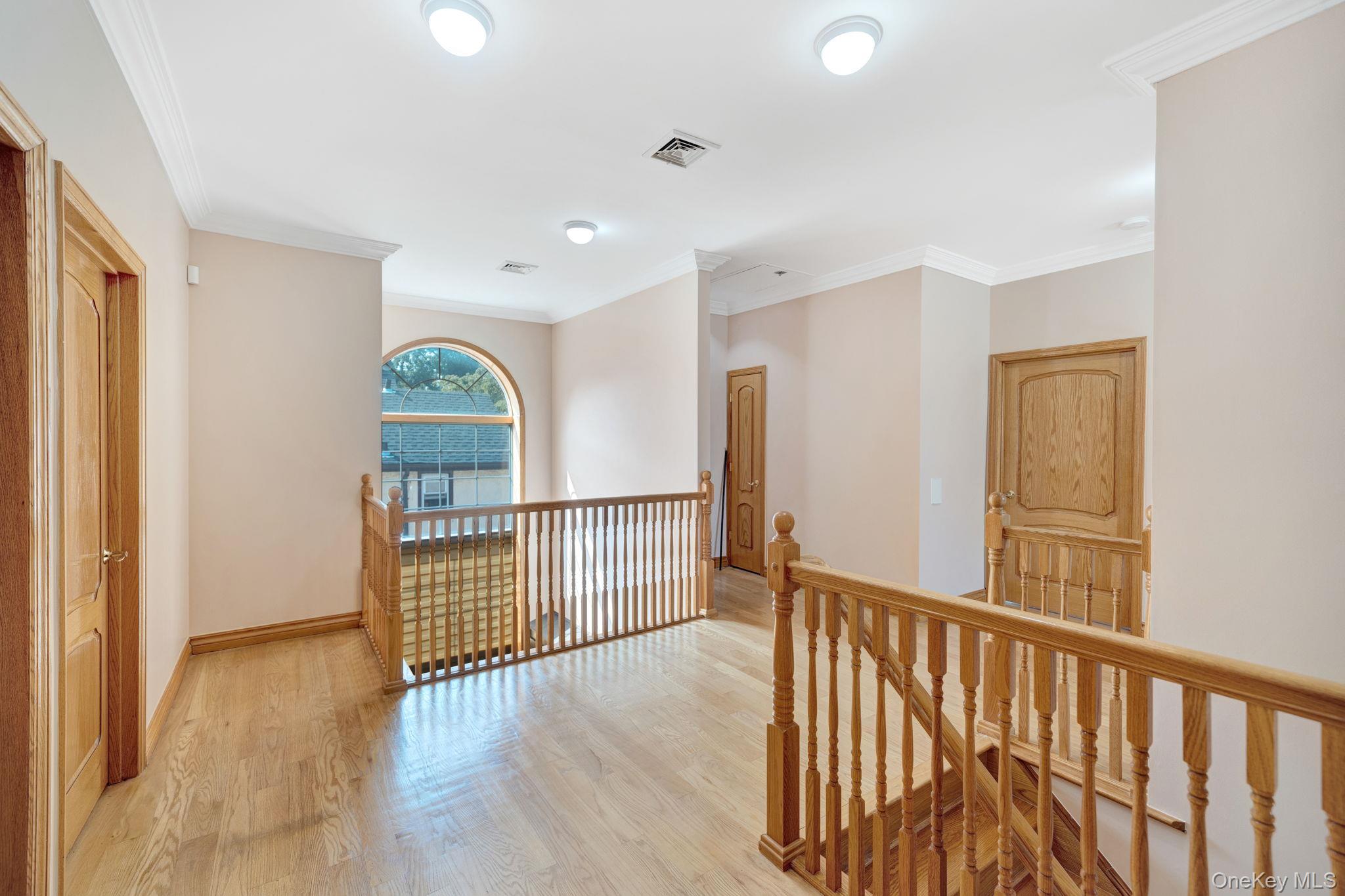 84-29 Kendrick Place Queens, NY 11432 - Photo 38 of 50 a view of a hallway with wooden floor and windows