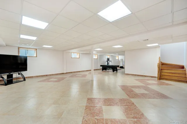 a view of kitchen with furniture and a flat screen tv