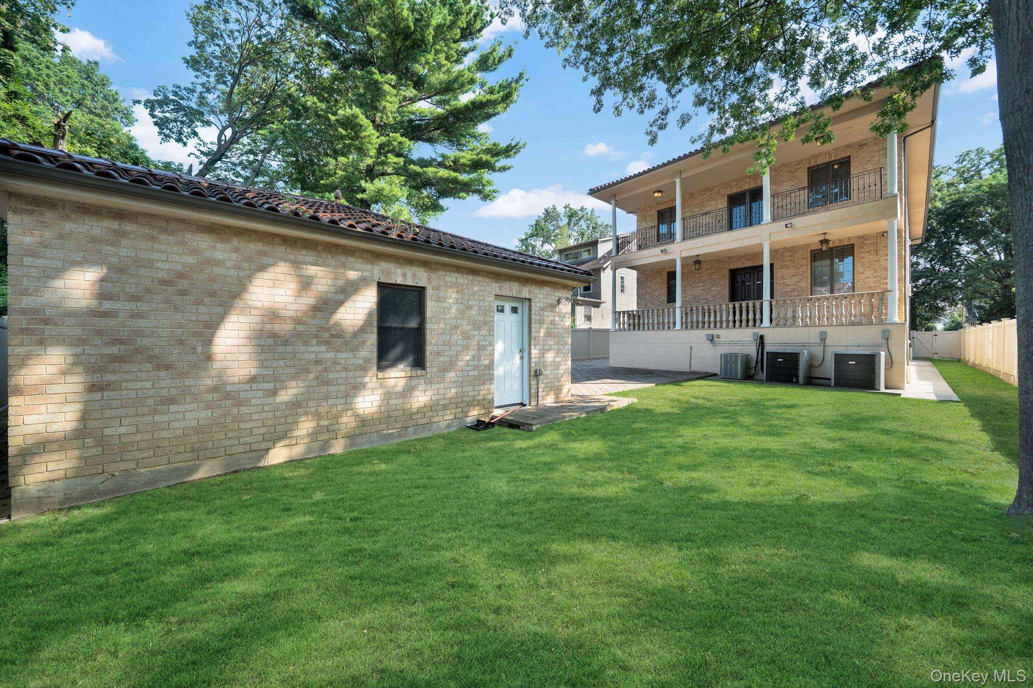 84-29 Kendrick Place Queens, NY 11432 - Photo 46 of 50 a front view of a house with a yard