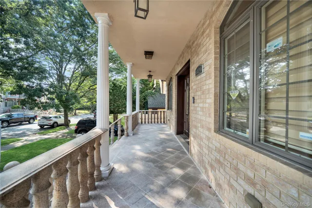 a view of a house with backyard and porch