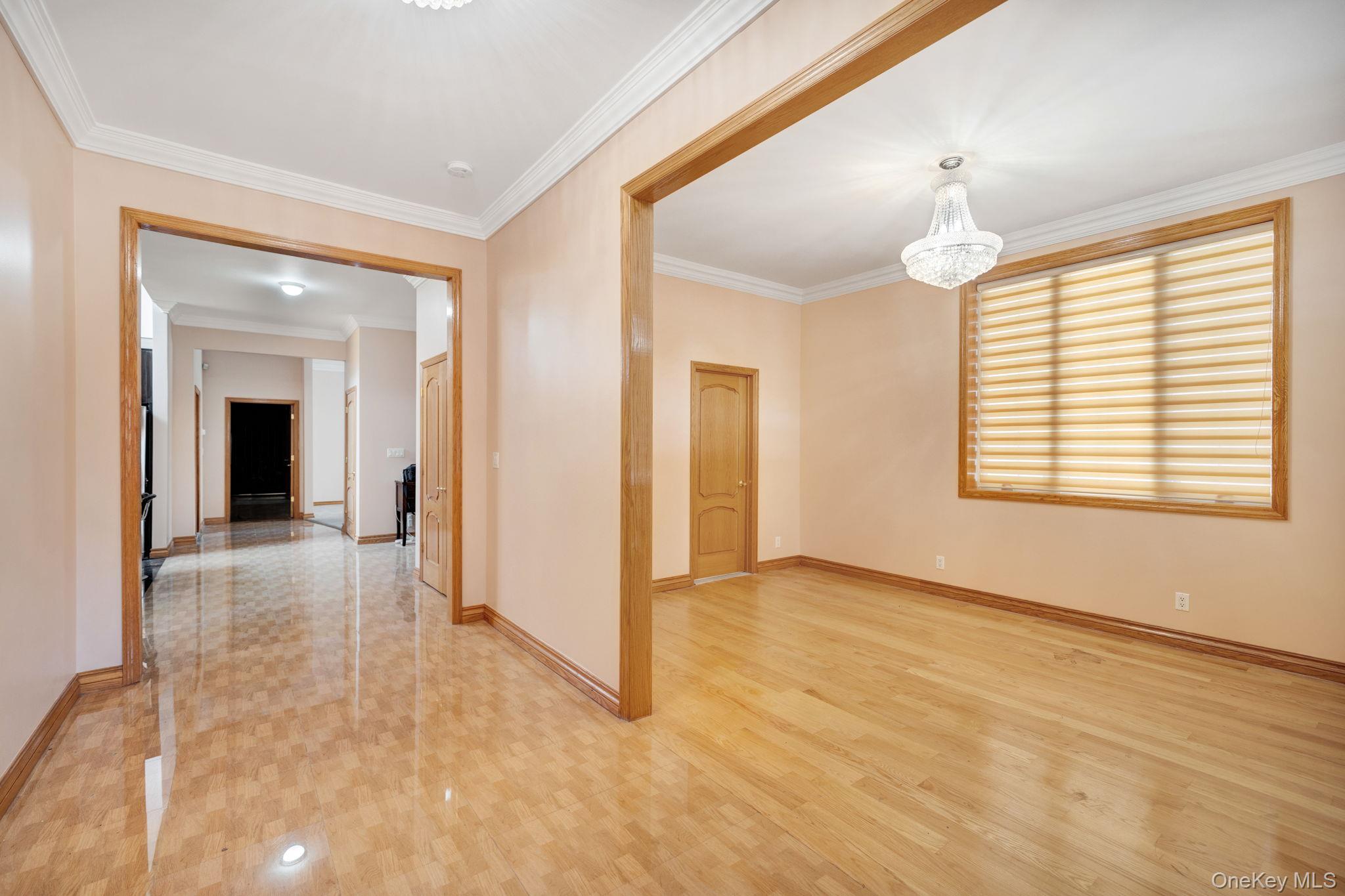 84-29 Kendrick Place Queens, NY 11432 - Photo 7 of 50 an empty room with windows and entrance