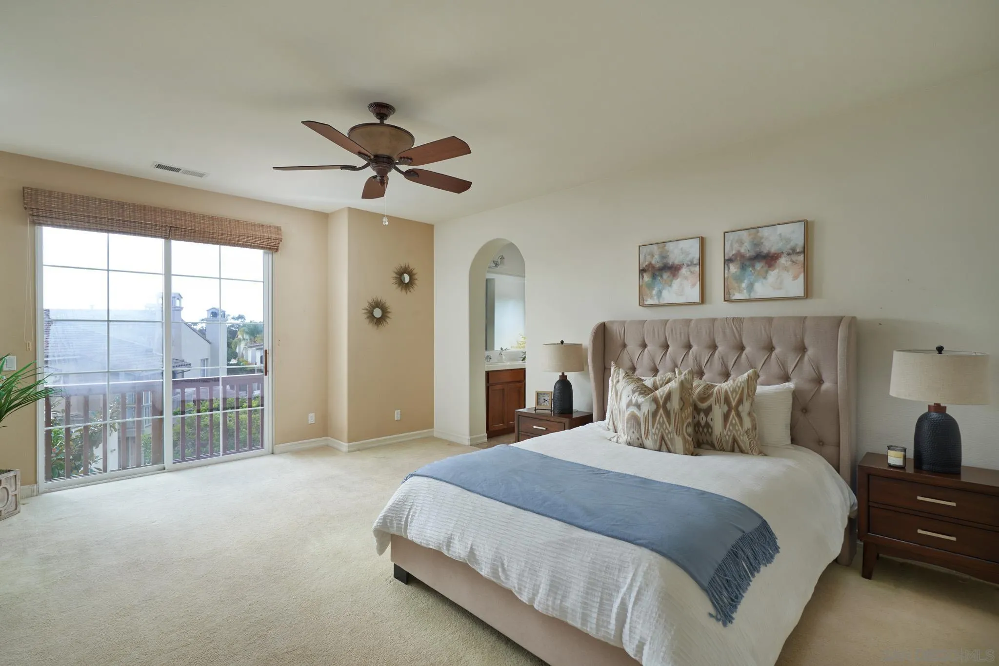 3177 Via Iris Carlsbad, CA 92009 - Photo 15 of 31 a spacious bedroom with a bed and a chandelier