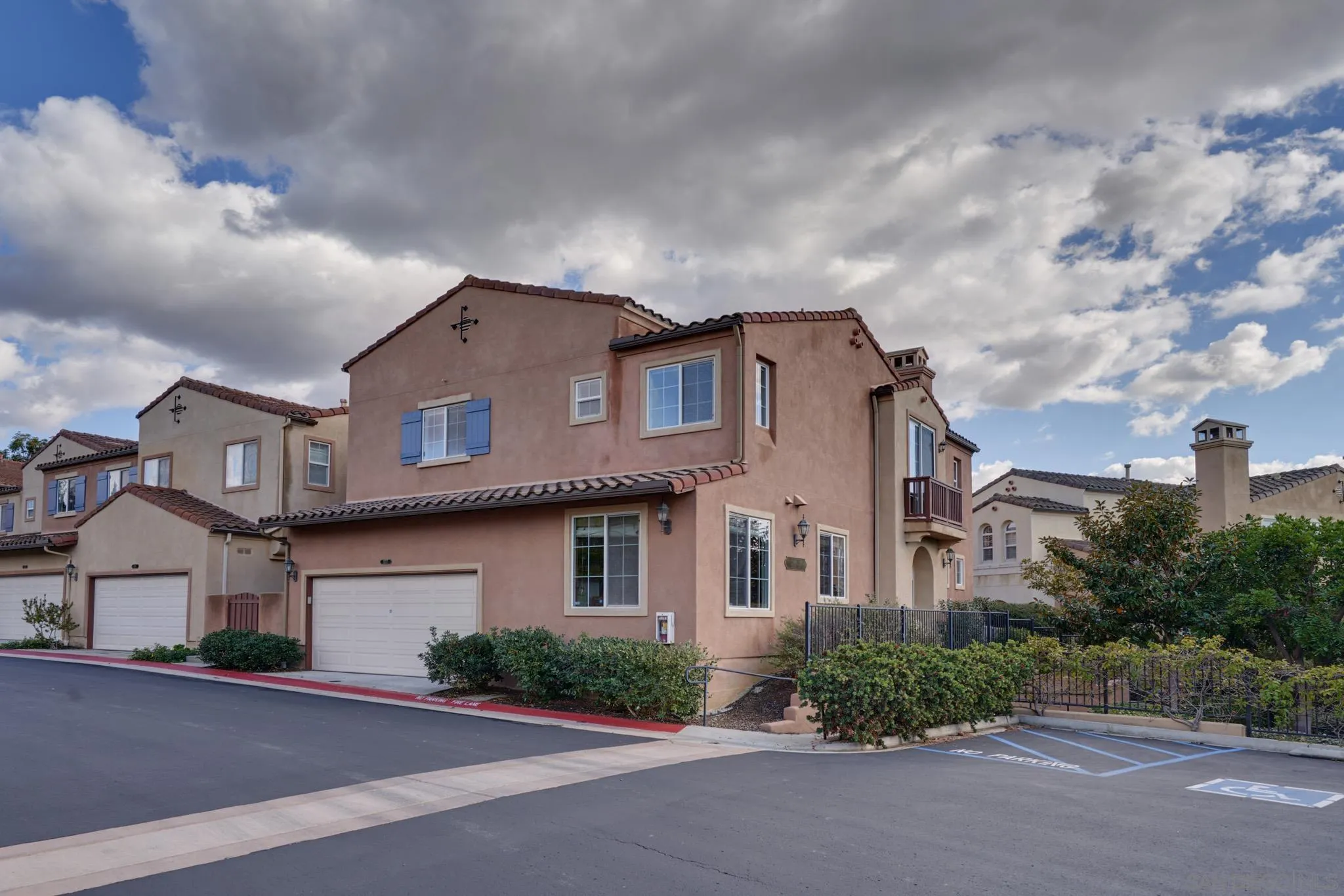 3177 Via Iris Carlsbad, CA 92009 - Photo 2 of 31 a front view of a house with a yard and garage