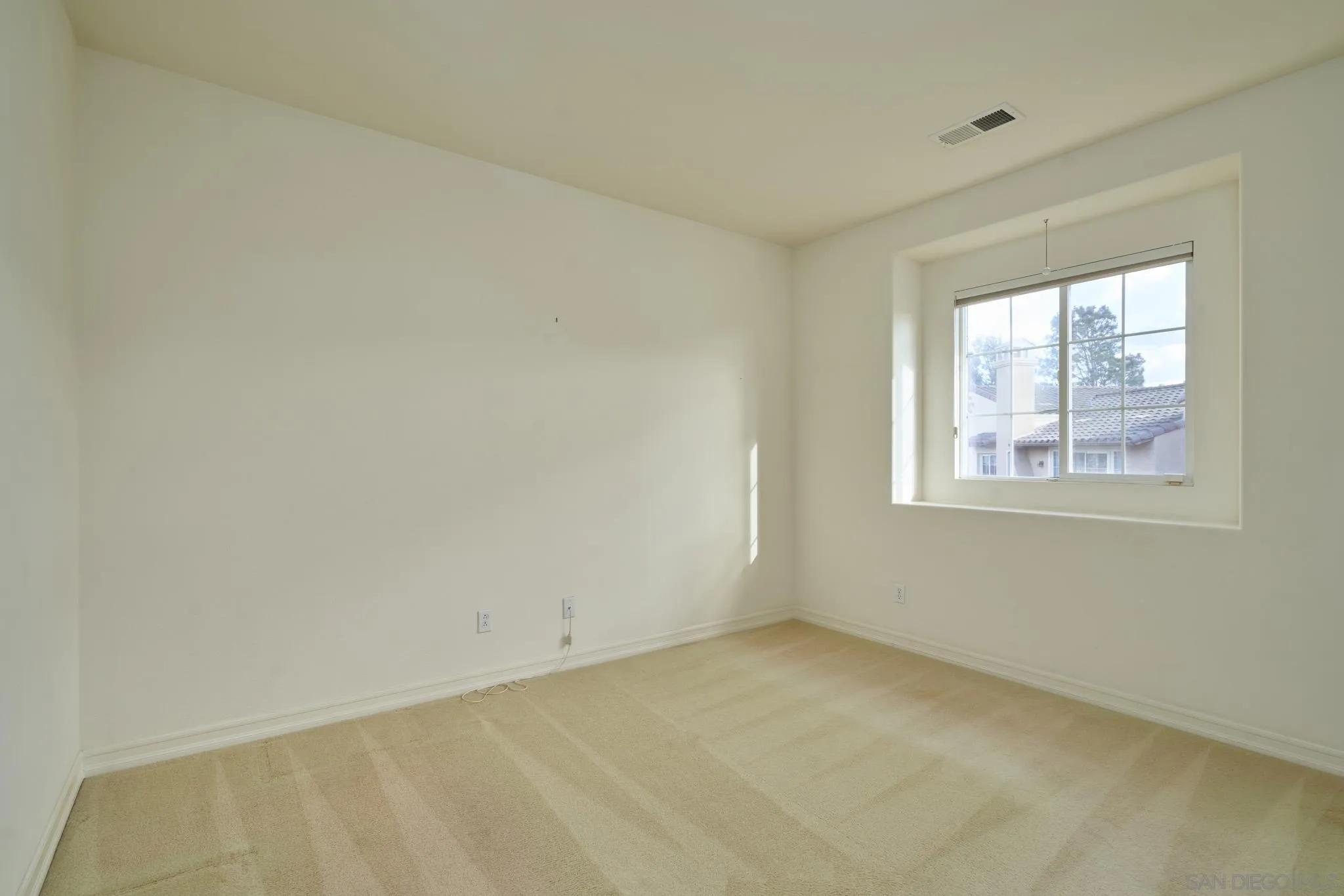 3177 Via Iris Carlsbad, CA 92009 - Photo 21 of 31 a view of an empty room with a window
