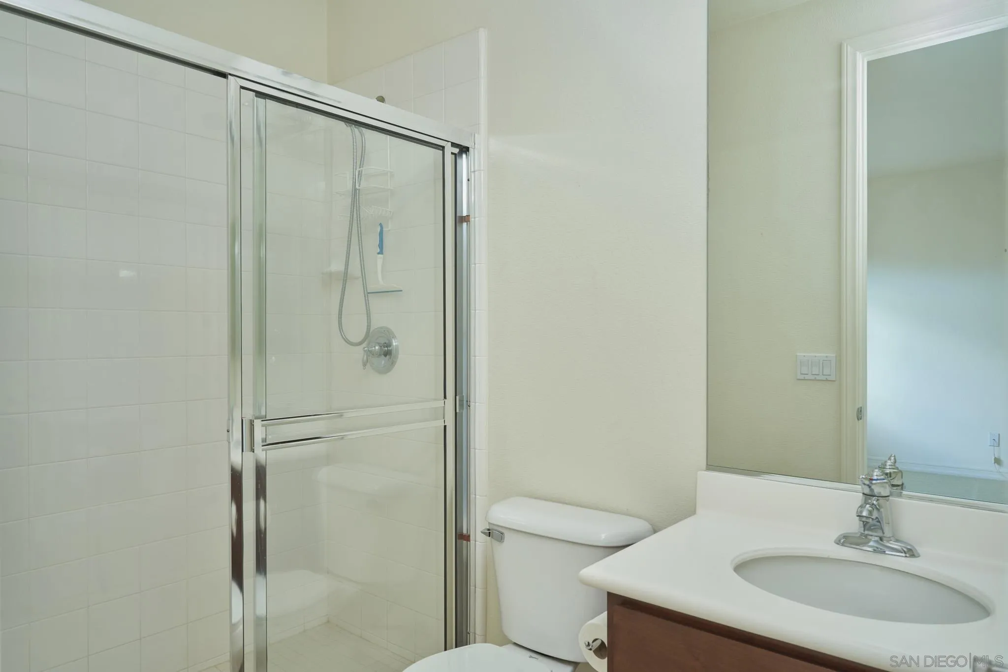 3177 Via Iris Carlsbad, CA 92009 - Photo 22 of 31 a bathroom with a granite countertop sink toilet and shower