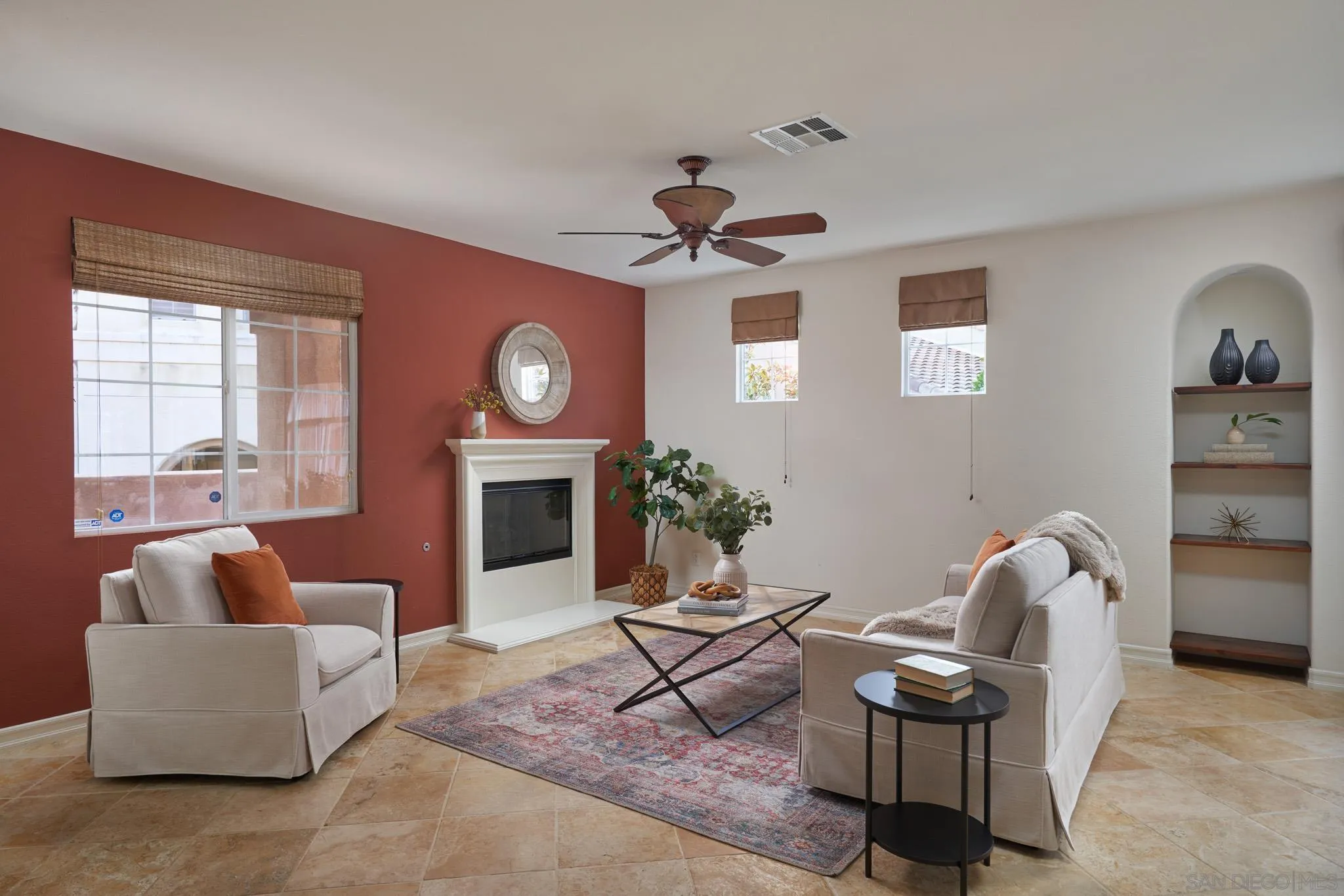 3177 Via Iris Carlsbad, CA 92009 - Photo 4 of 31 a living room with furniture a chandelier and a fireplace