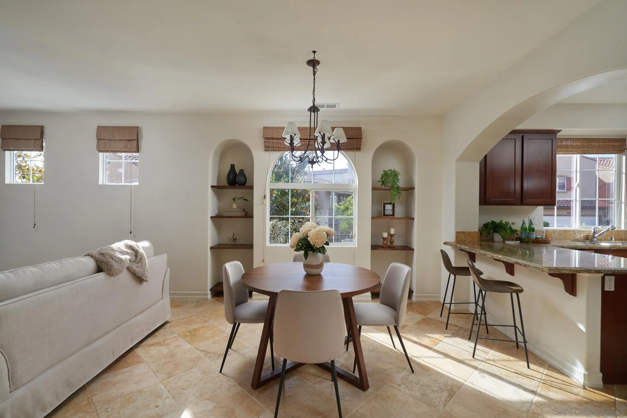 3177 Via Iris Carlsbad, CA 92009 - Photo 5 of 31 a dining room with furniture a chandelier and window
