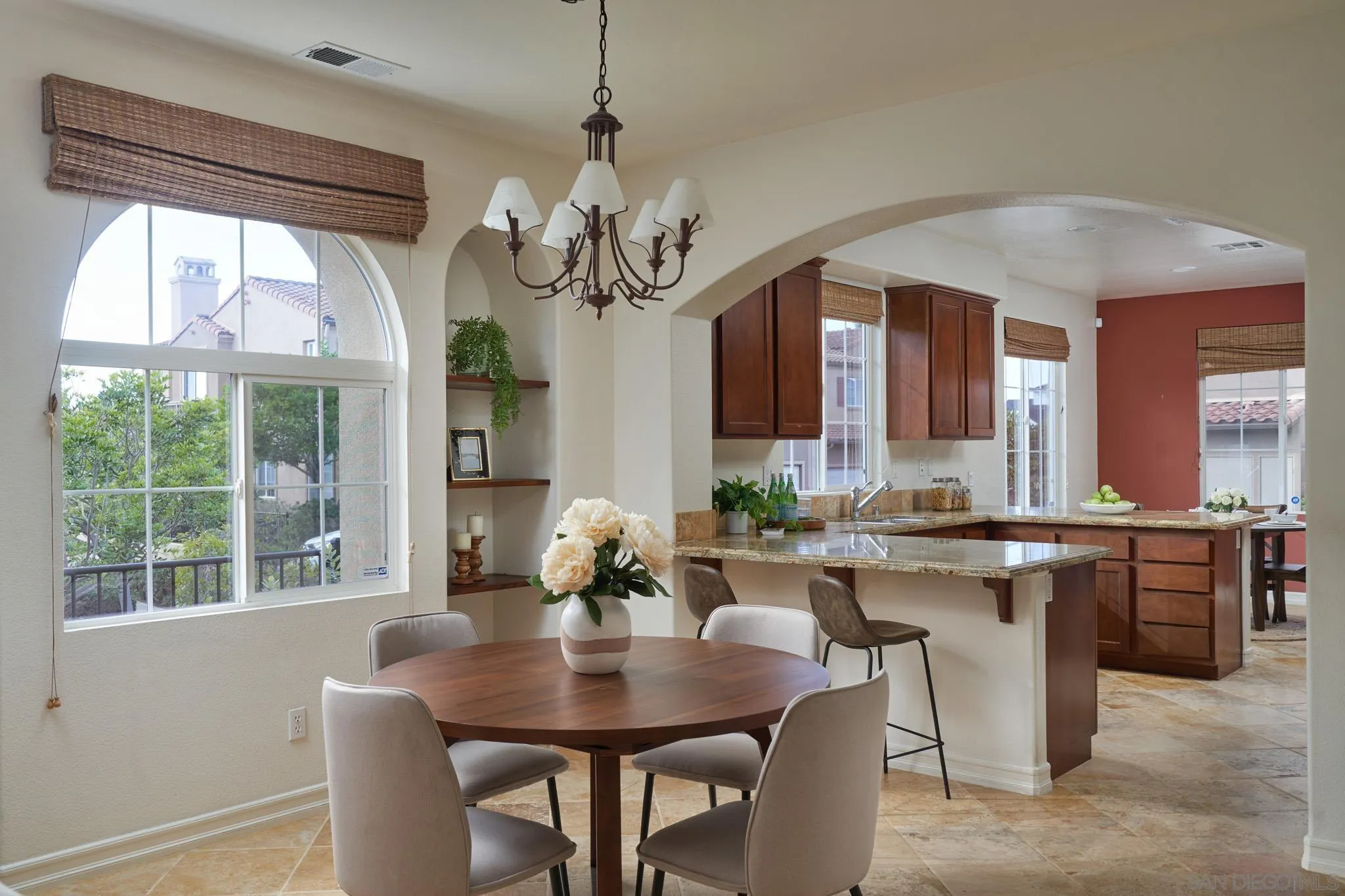 3177 Via Iris Carlsbad, CA 92009 - Photo 6 of 31 a view of a dining room with furniture wooden floor and chandelier