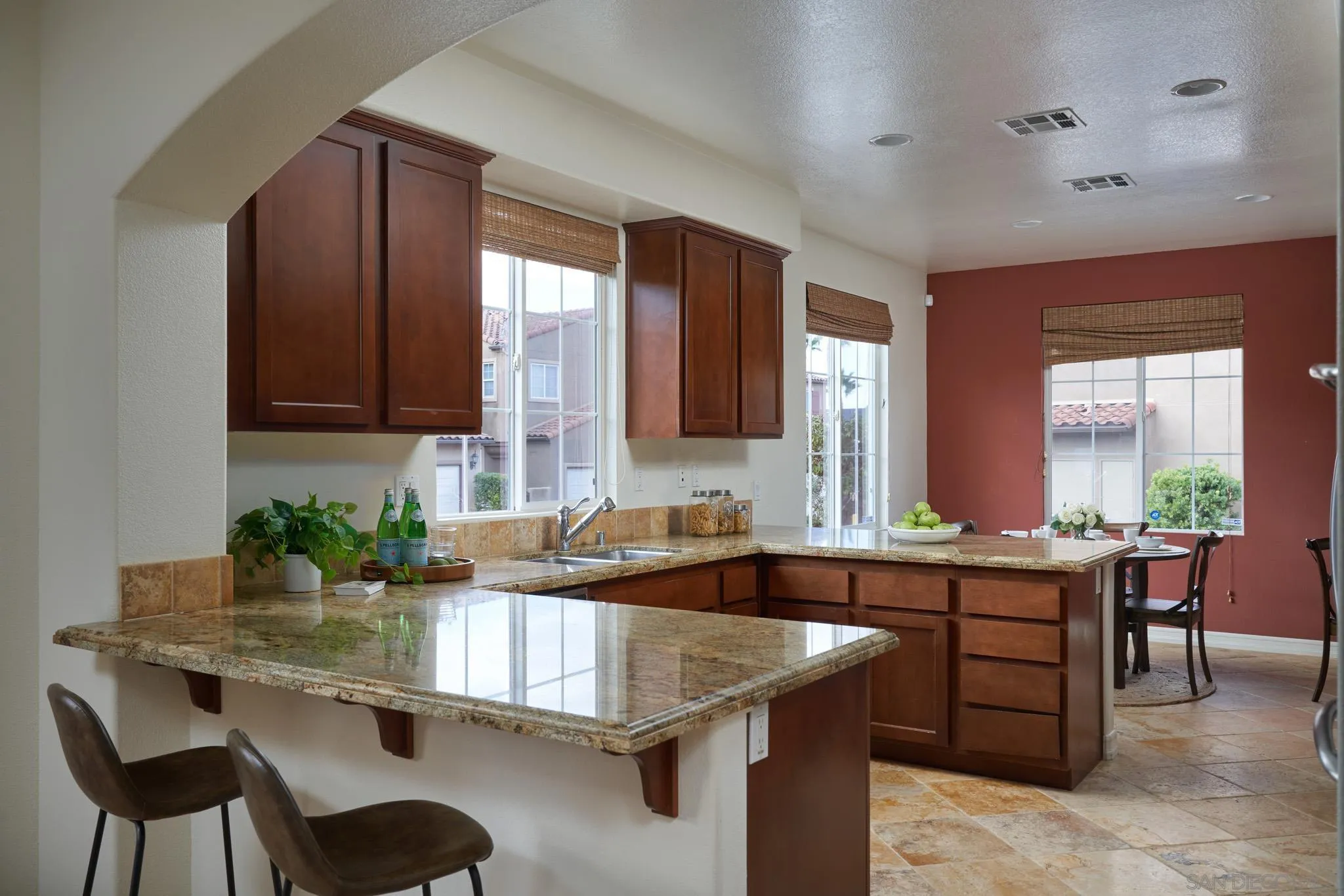 3177 Via Iris Carlsbad, CA 92009 - Photo 9 of 31 a kitchen with a sink and cabinets