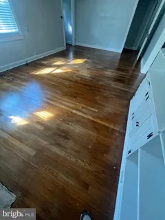 a kitchen with granite countertop a refrigerator and a sink