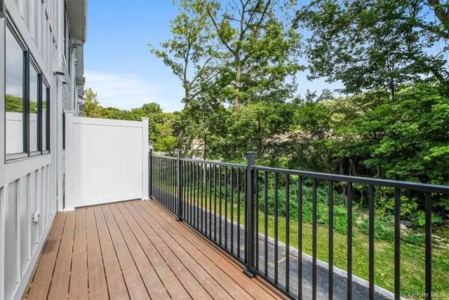 a balcony with trees in front of it