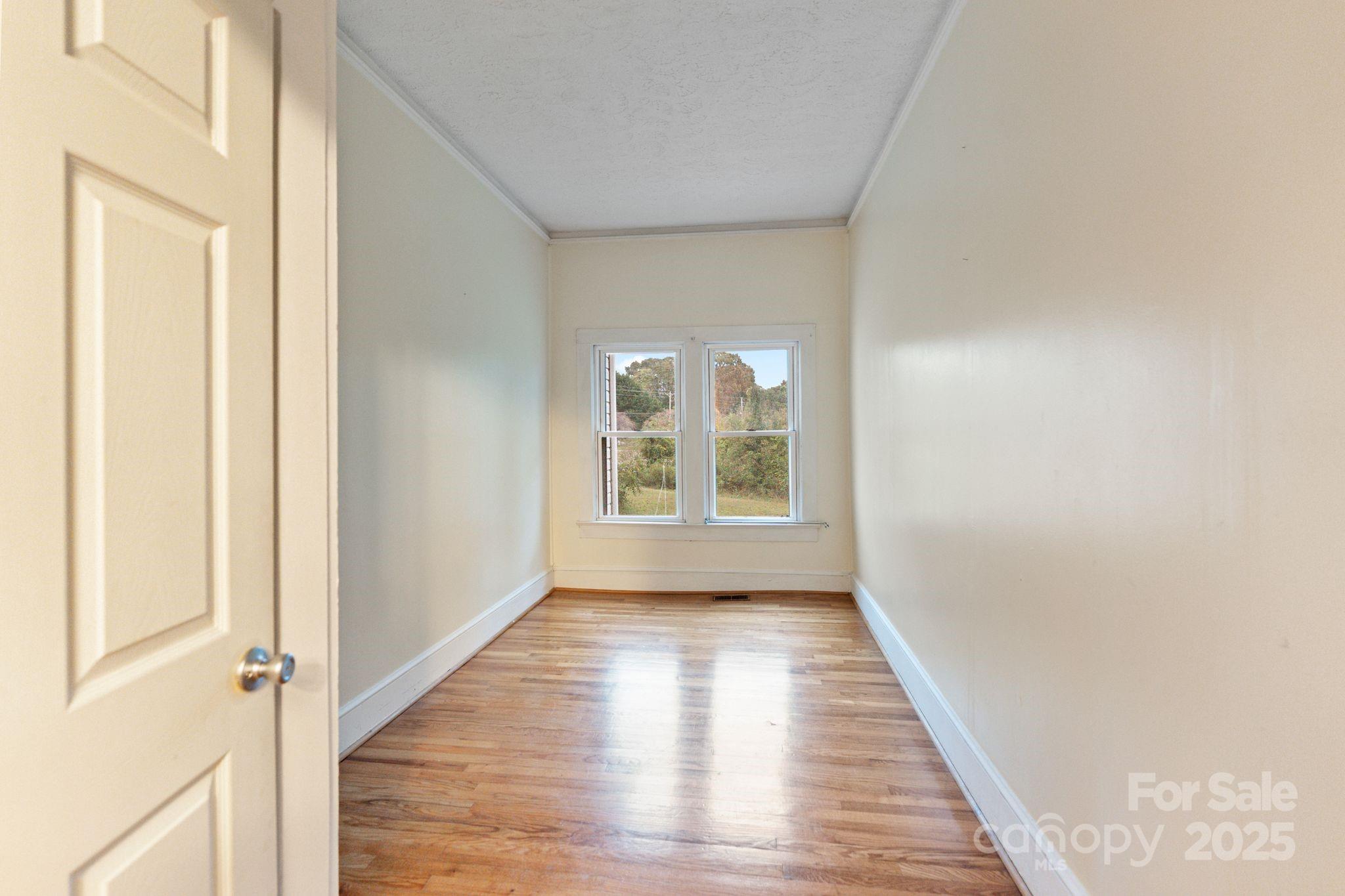 6921 Harmony Grove Road Nebo, NC 28761 - Photo 18 of 20 a view of a room with wooden floor and window