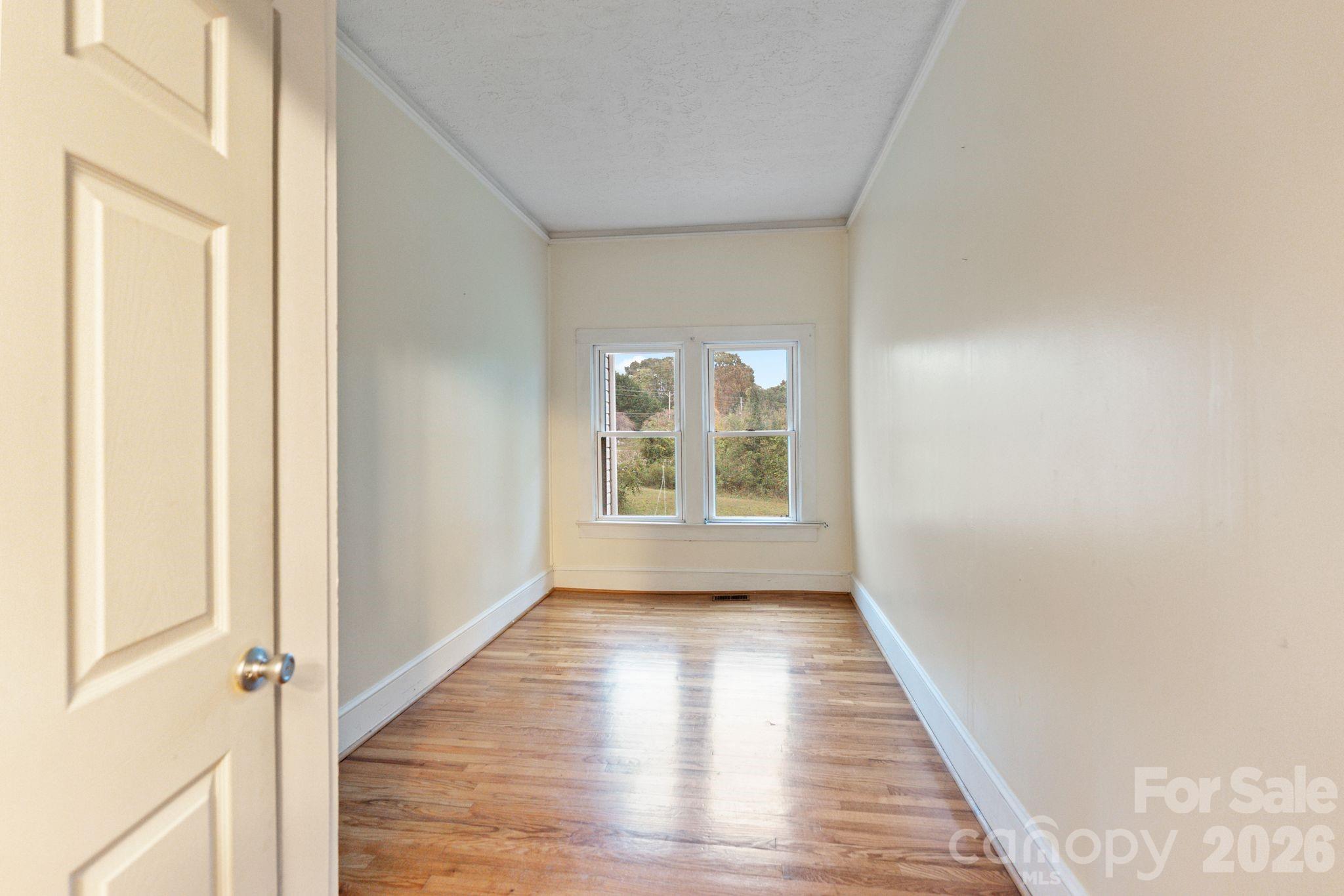 6921 Harmony Grove Road Nebo, NC 28761 - Photo 20 of 21 a view of a room with wooden floor and window