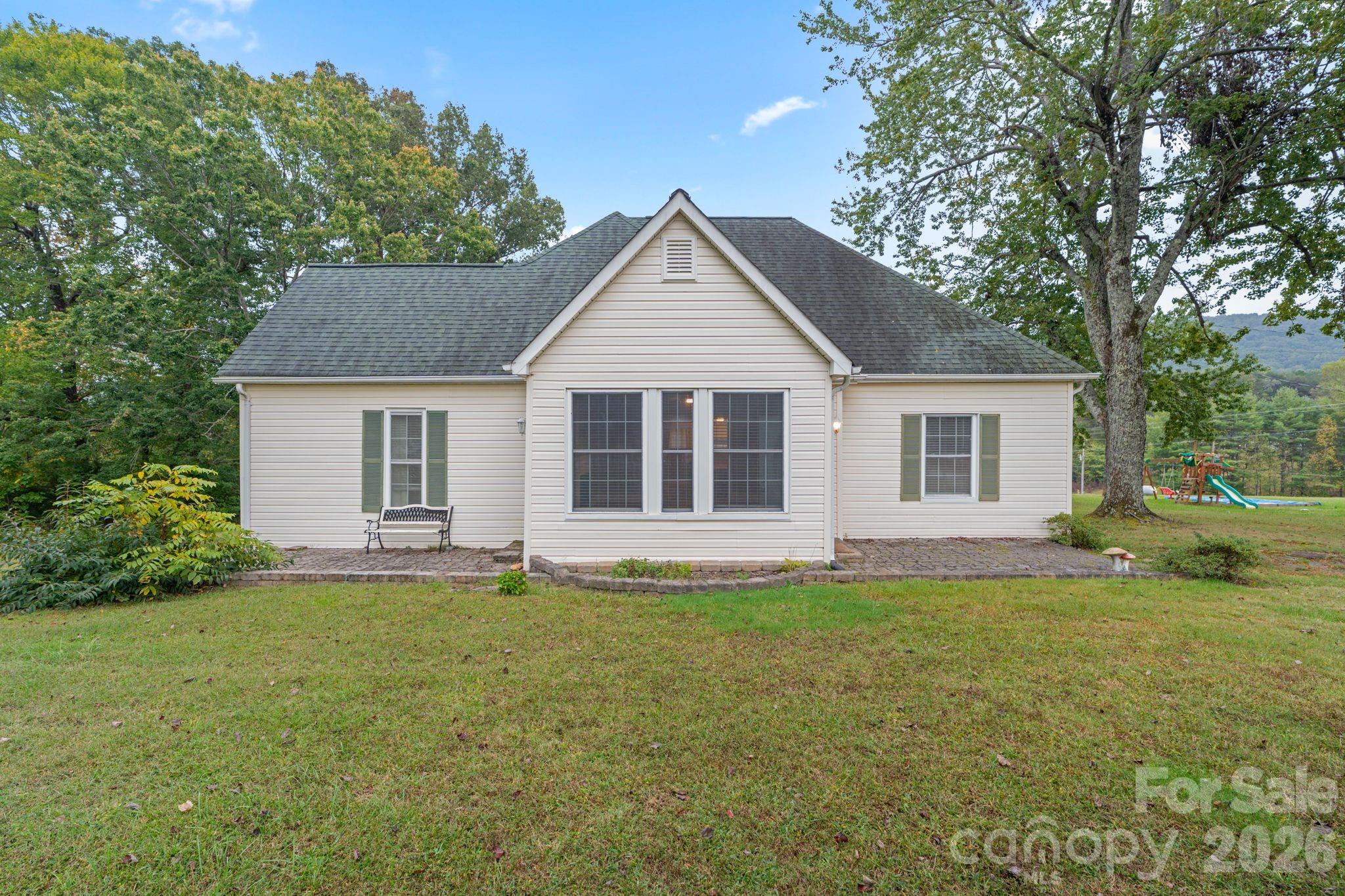 6921 Harmony Grove Road Nebo, NC 28761 - Photo 2 of 21 a big house with a big yard and large trees
