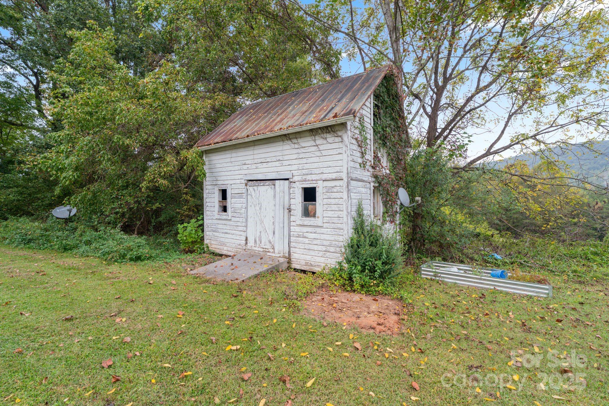 6921 Harmony Grove Road Nebo, NC 28761 - Photo 4 of 20 a view of a house with a yard