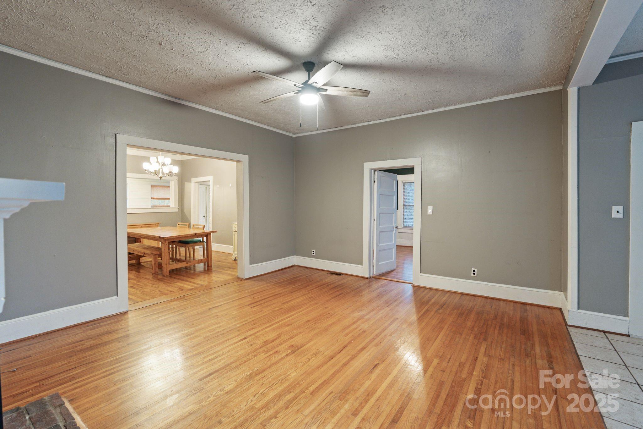 6921 Harmony Grove Road Nebo, NC 28761 - Photo 6 of 20 wooden floor in an empty room with a window