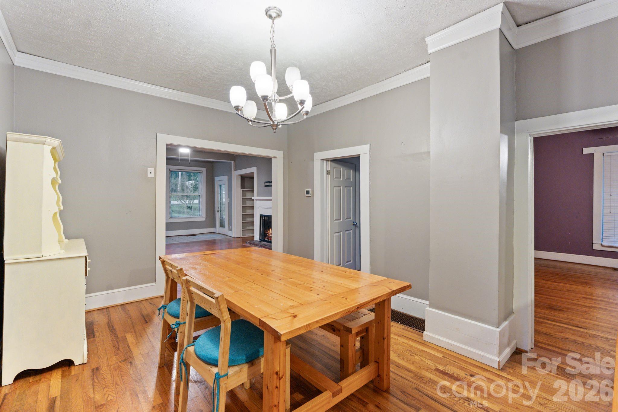 6921 Harmony Grove Road Nebo, NC 28761 - Photo 6 of 21 a view of a dining room with furniture and wooden floor