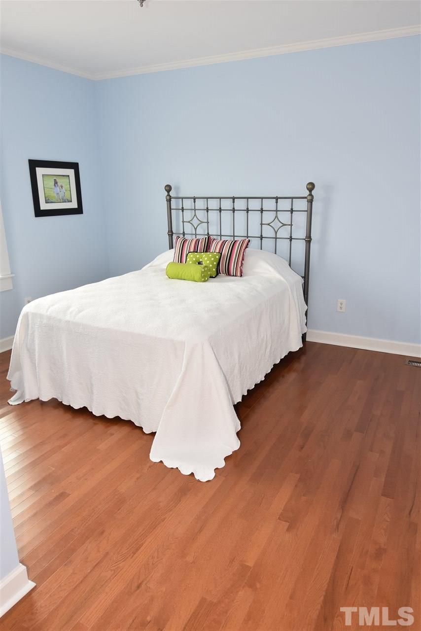 2001 Harvey Lewis Road Faison, NC 28341 - Photo 11 of 25 a bed sitting in a bedroom next to a white wall