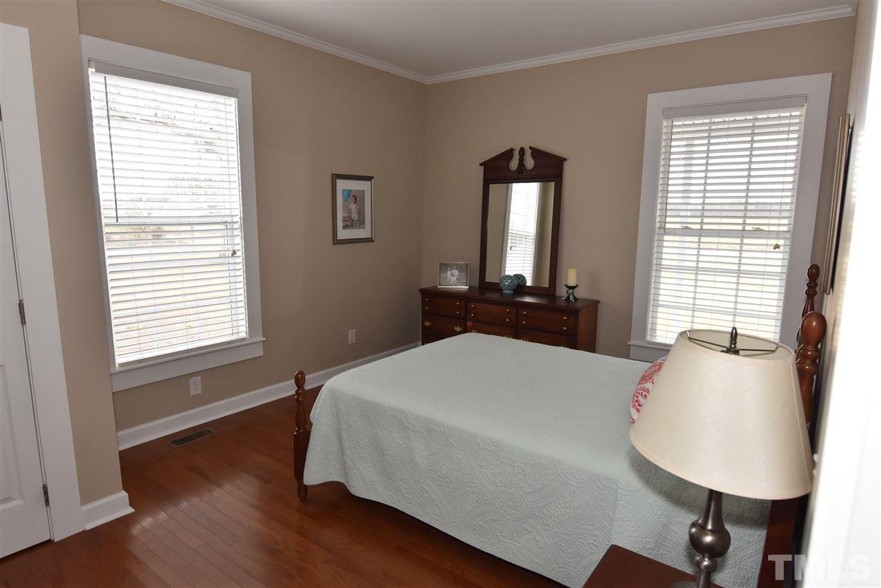 2001 Harvey Lewis Road Faison, NC 28341 - Photo 16 of 25 a bed sitting in a bedroom next to a window