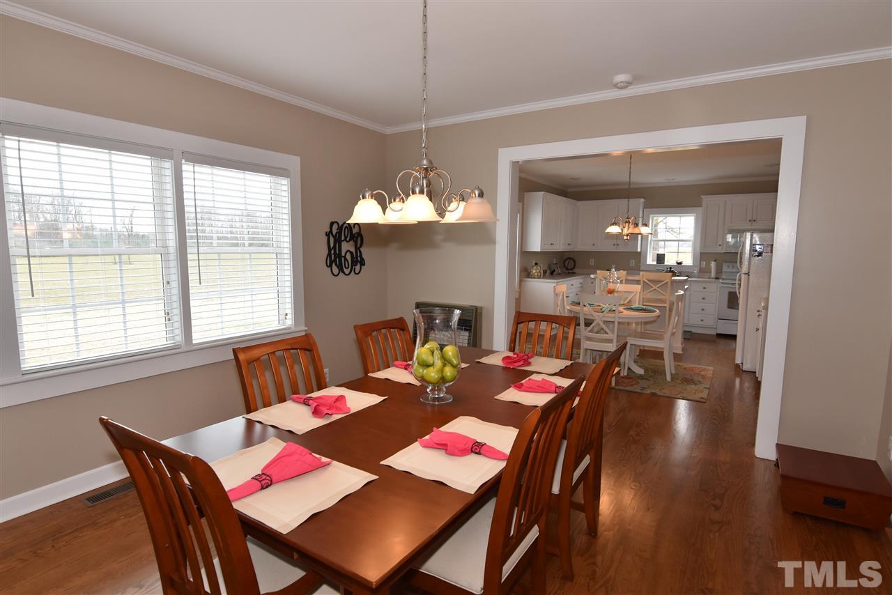 2001 Harvey Lewis Road Faison, NC 28341 - Photo 18 of 25 a view of a dining room with furniture and wooden floor