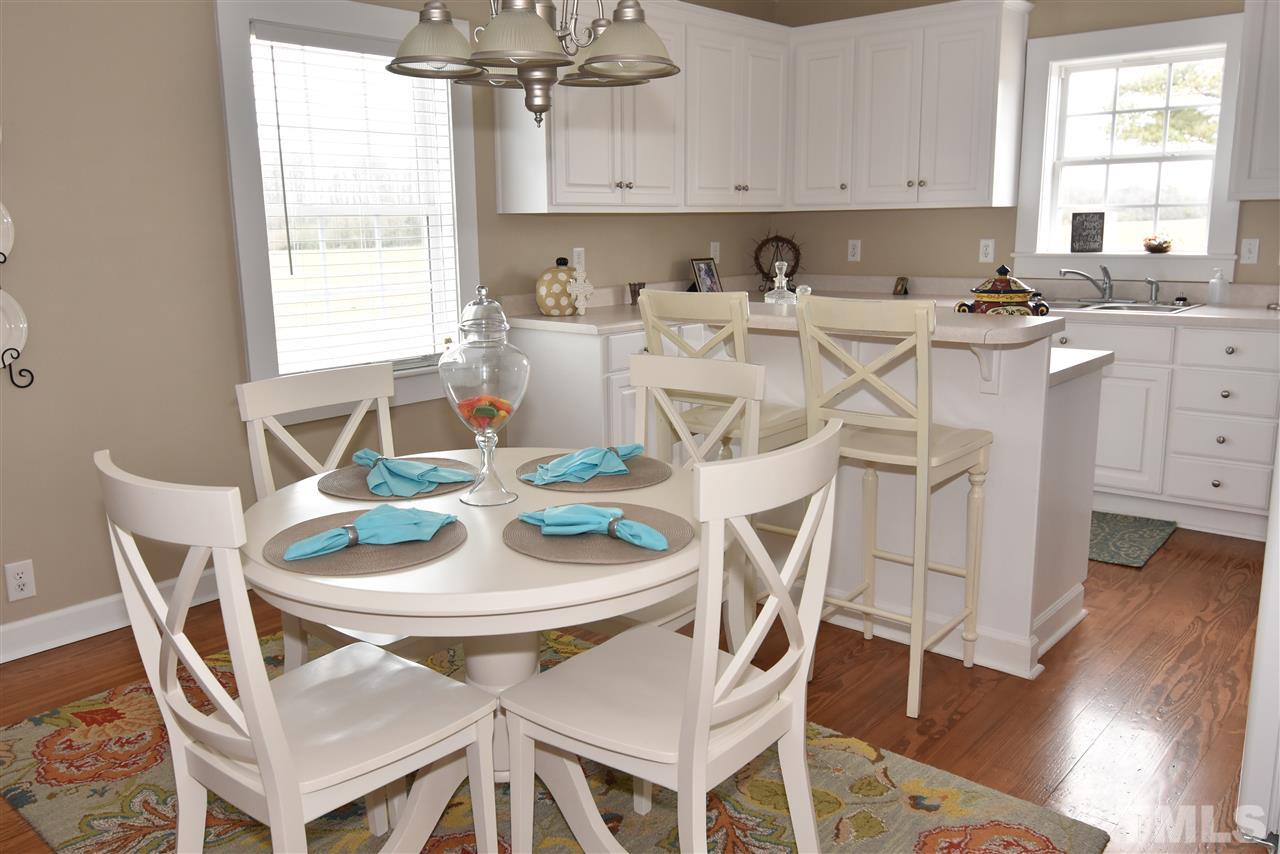 2001 Harvey Lewis Road Faison, NC 28341 - Photo 22 of 25 a view of a dining room with furniture and wooden floor