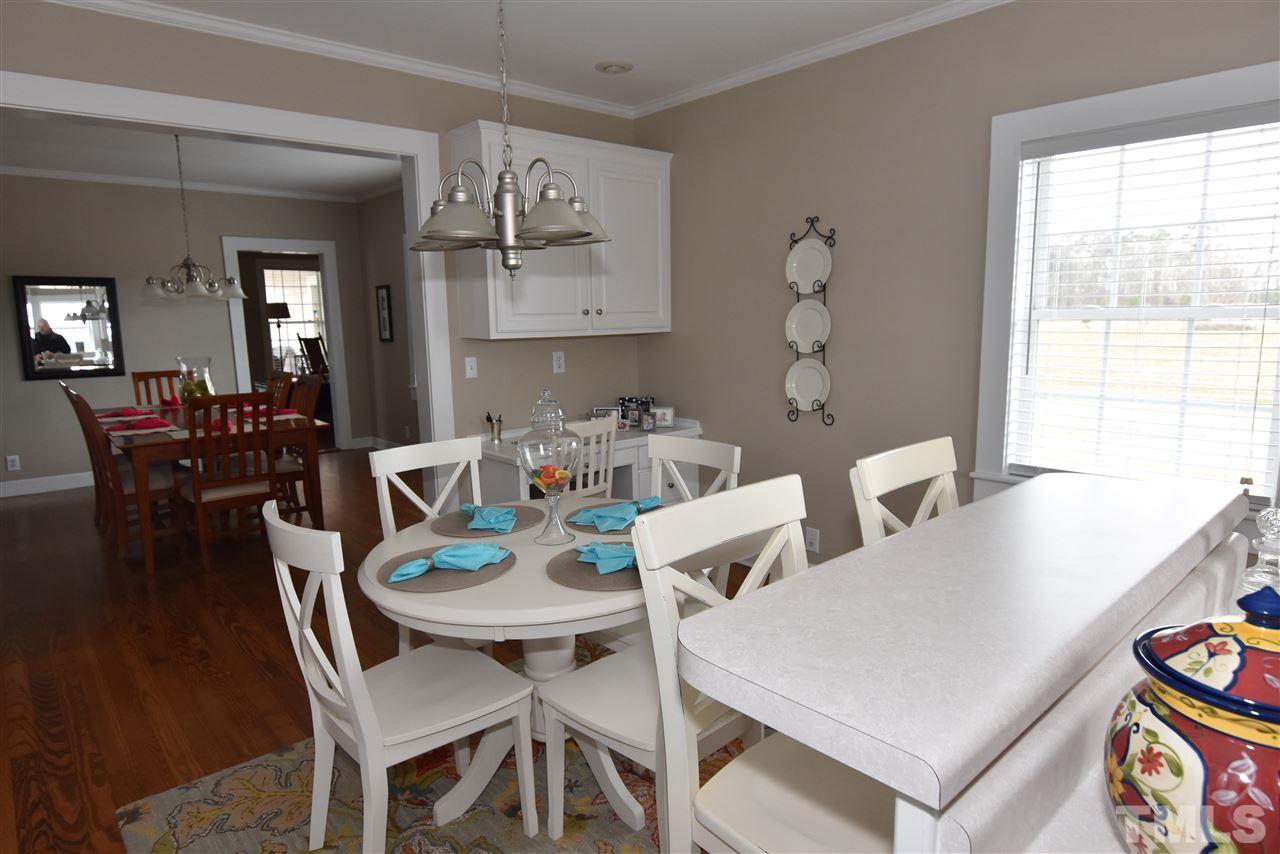 2001 Harvey Lewis Road Faison, NC 28341 - Photo 23 of 25 a view of a dining room with furniture and wooden floor
