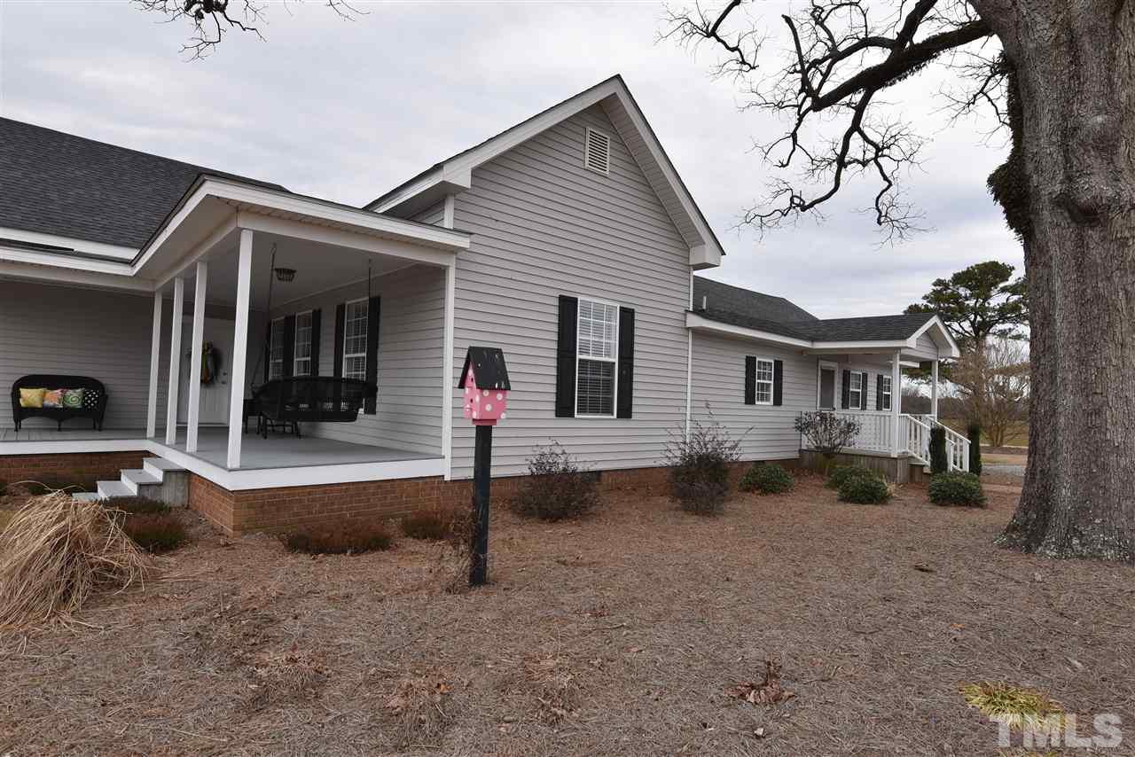 2001 Harvey Lewis Road Faison, NC 28341 - Photo 5 of 25 a view of a house with a patio and a yard