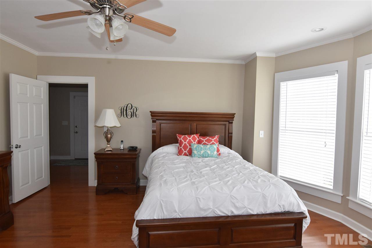 2001 Harvey Lewis Road Faison, NC 28341 - Photo 9 of 25 a bedroom with a bed and wooden floor