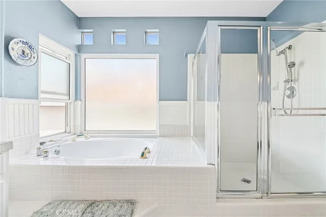 a bathroom with a toilet and a mirror